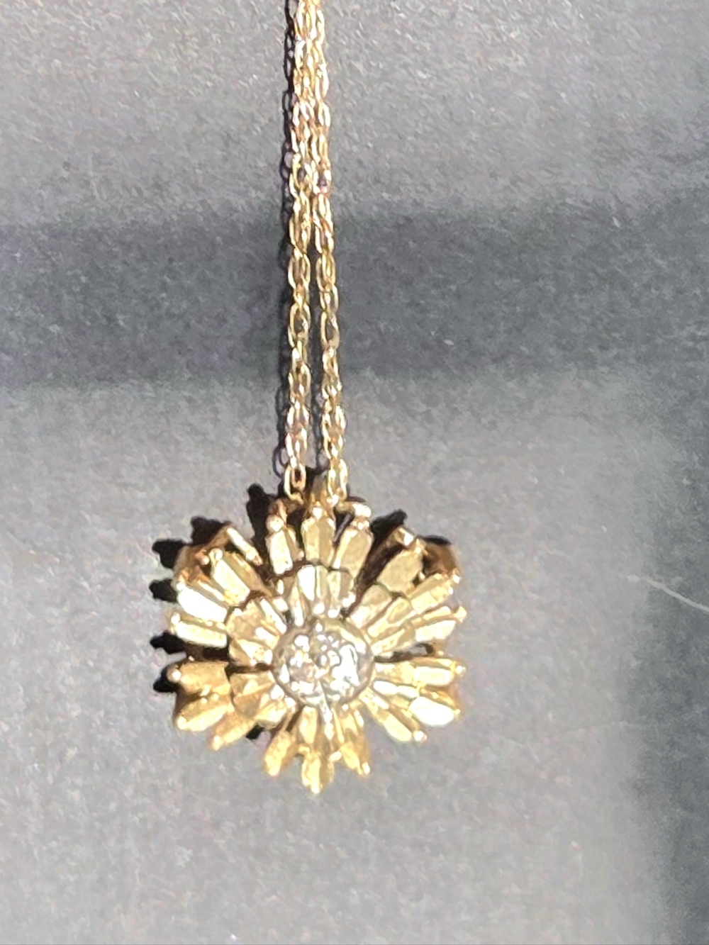 Gold star burst flower charm with solid gold 18 inch necklace